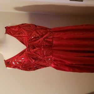 Long RED prom dress with pockets. Its full and made to fit.